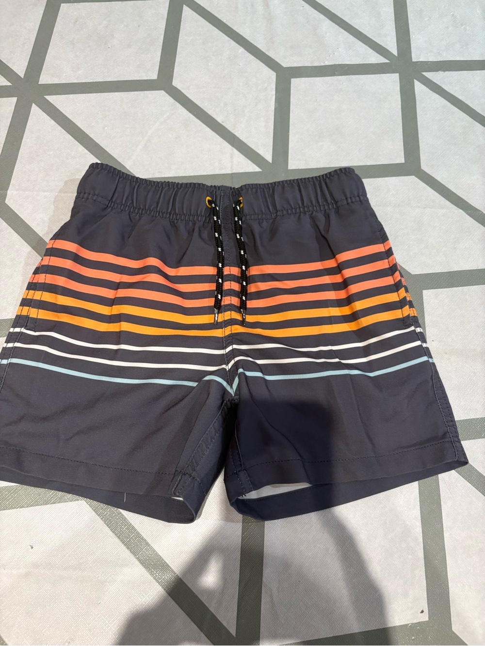 3/15$ Navy Swim Trunks with Orange & Yellow Stripes